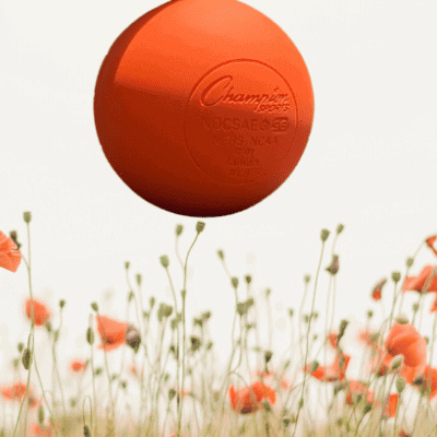 Orange ball floating in orange poppy field