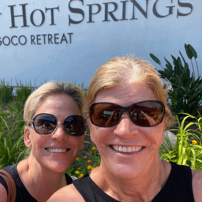 Two ladies stand together