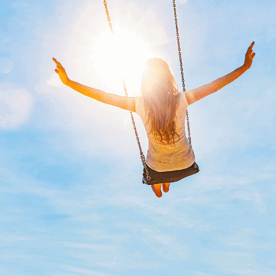 Lady swinging in the air on a swing