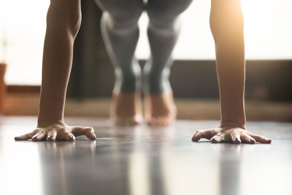 close up image of woman doing a push up